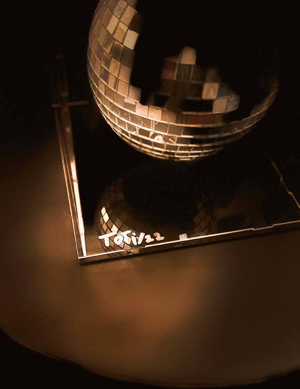 The Moon sculpture detail – Rosana Auqué at Art Basel Miami Detail view of The Moon sculpture by Rosana Auqué, illuminated under warm light at Art Basel Miami.