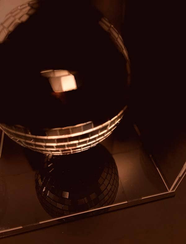 The Moon sculpture – upper perspective view Upper view of The Moon sculpture by Rosana Auqué, showing the sphere’s reflective geometry and shadow.