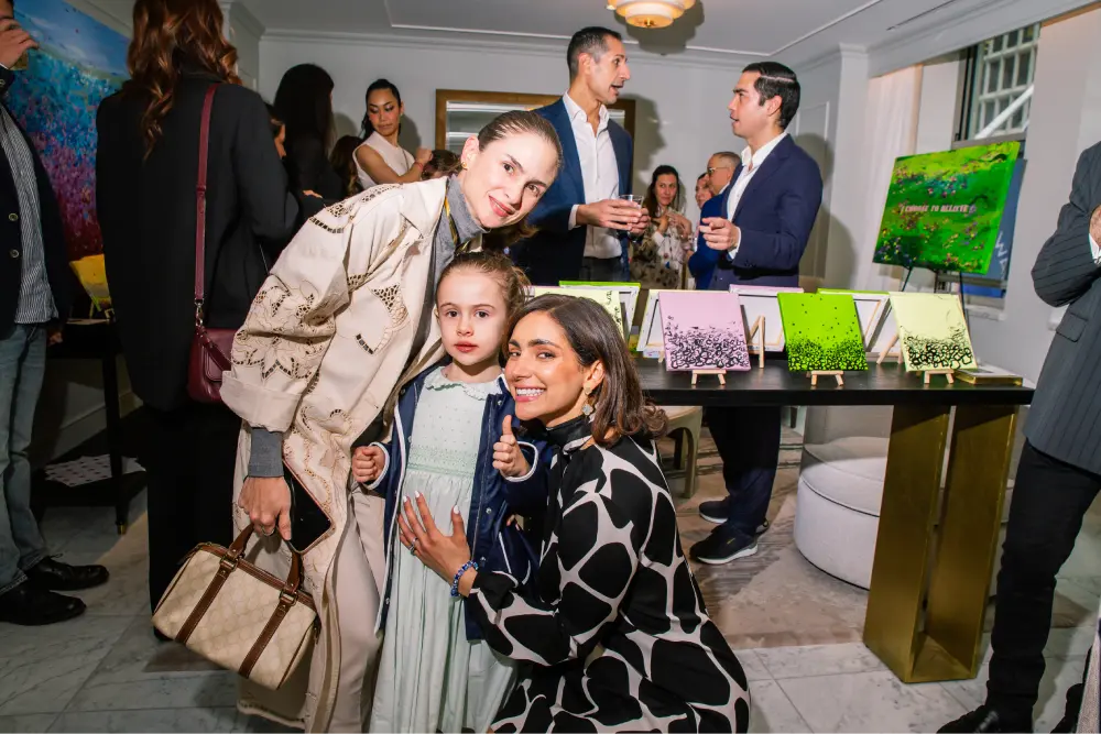 Rosana Auqué with visitors during An Evening of Art at Waldorf Astoria New York